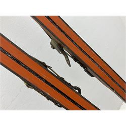 Pair of 1930s wooden skis, with painted metal runners beneath stamped Attenhofer, with retailers label for Ernst Gertsch Central Sports, L206cm