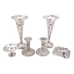 Group of silver, to include modern silver ashtray, hallmarked Mappin & Webb Ltd, Sheffield 1973, pair of modern silver trumpet vases, of typical form, each with knopped stem and upon circular stepped weighted foot, hallmarked Joseph Gloster Ltd, Birmingham 1973, H20cm, together with a pair of modern silver mounted candlesticks, each with repousse bird and foliate decoration and upon weighted bases, hallmarked W I Broadway & Co, Birmingham 1967, H10cm and a silver bon bon dish, of plain circular form upon pedestal and stepped filled foot, hallmarked Levi & Salaman, Birmingham 1913, H5.2cm