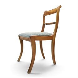 19th century mahogany extending dining table, rectangular top with rounded corners raised on turned and fluted supports with brass cups and castors, with two additional leaves; with set of eight (6+2) Regency design mahogany dining chairs, spiral-reeded back-bar over drop-in seats and sabre supports (W54cm H85cm)
