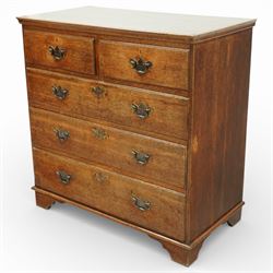 George III oak chest of drawers, the plain moulded top above a two over three drawer arrangement with pierced brass fittings, the case raised on bracket feet