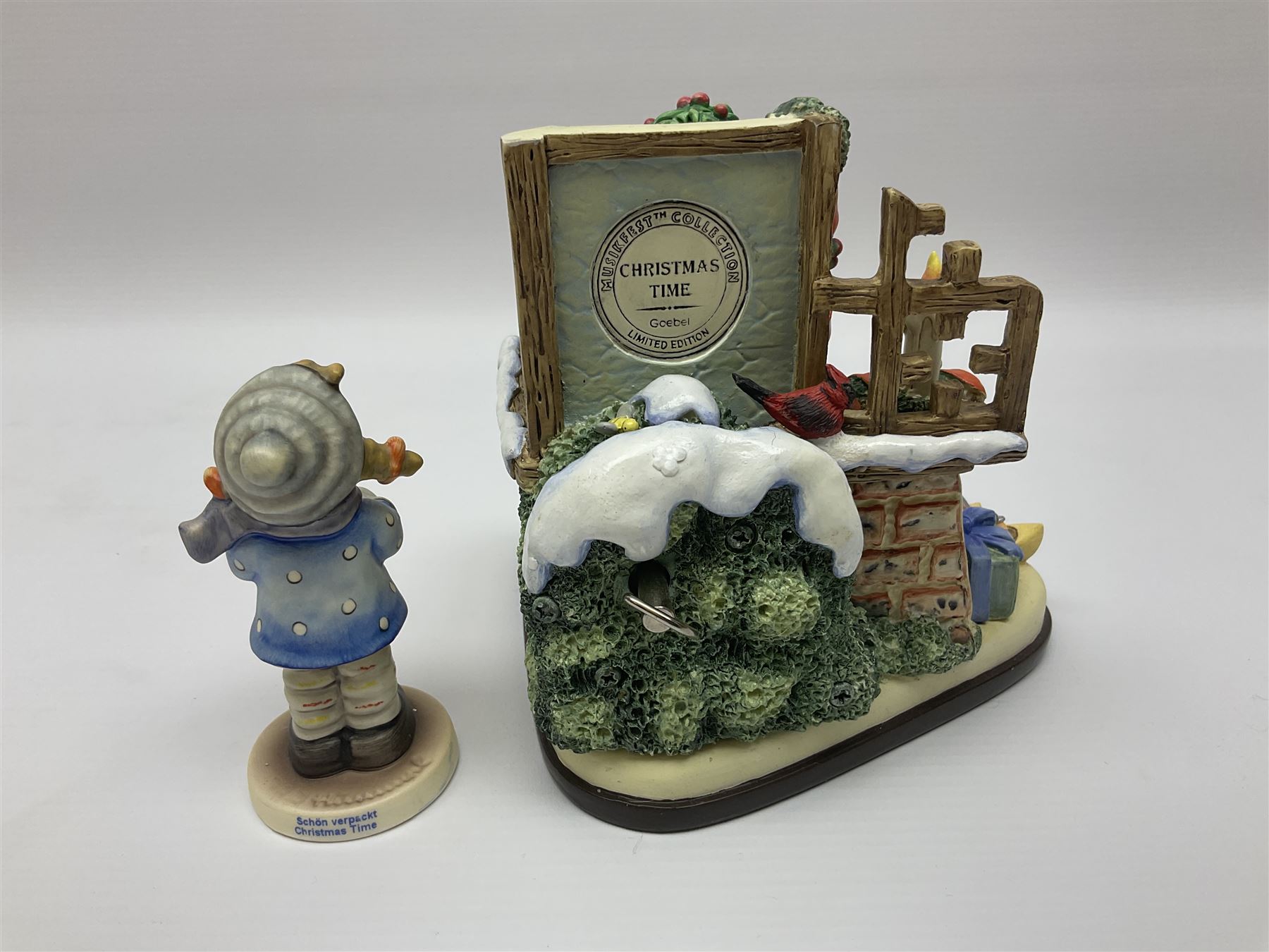 Eight Christmas Hummel figures by Goebel, to include Wintertime Chapel candle holder, Winter Fun, Christmas Morning, Christmas Time and Gingerbread Lane, tallest H21cm