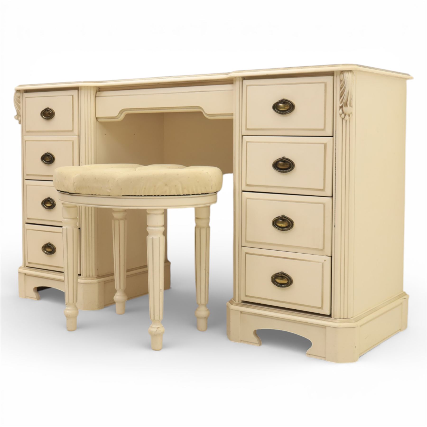 Contemporary French design white painted bedroom suite retailed by Barkers of Northallerton, comprising wide chest fitted with four short and four long drawers with oval brass handles (H 70cm, W 159cm, D 46cm), pair of bedside chests each fitted with three drawers (H 62cm, W 40cm, D 46cm), dressing table fitted with four short drawers and central kneehole with shaped apron (H 79cm, W 131cm, D 46cm) with matching framed wall mounted mirror (H 100cm, W 113cm), and full length standing mirror (H 175cm, W 73cm)