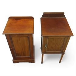 Two Edwardian mahogany bedside cabinets, each enclosed by a single panelled door, one with a raised gallery back and square tapering legs (H 84cm, W 40cm, D 40cm), the other of plinth-base form (H 77cm, W 40cm, D 35cm)