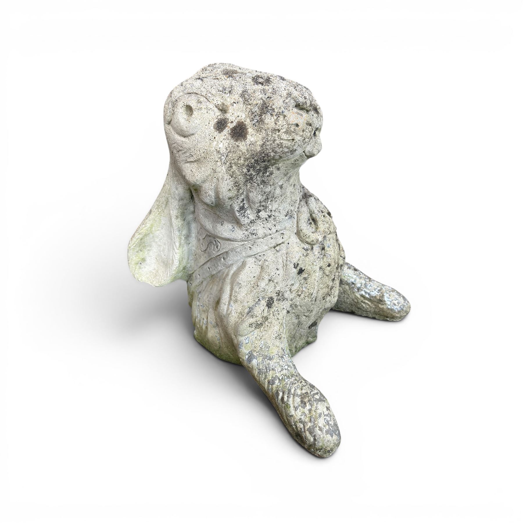 Two weathered cast stone garden hares