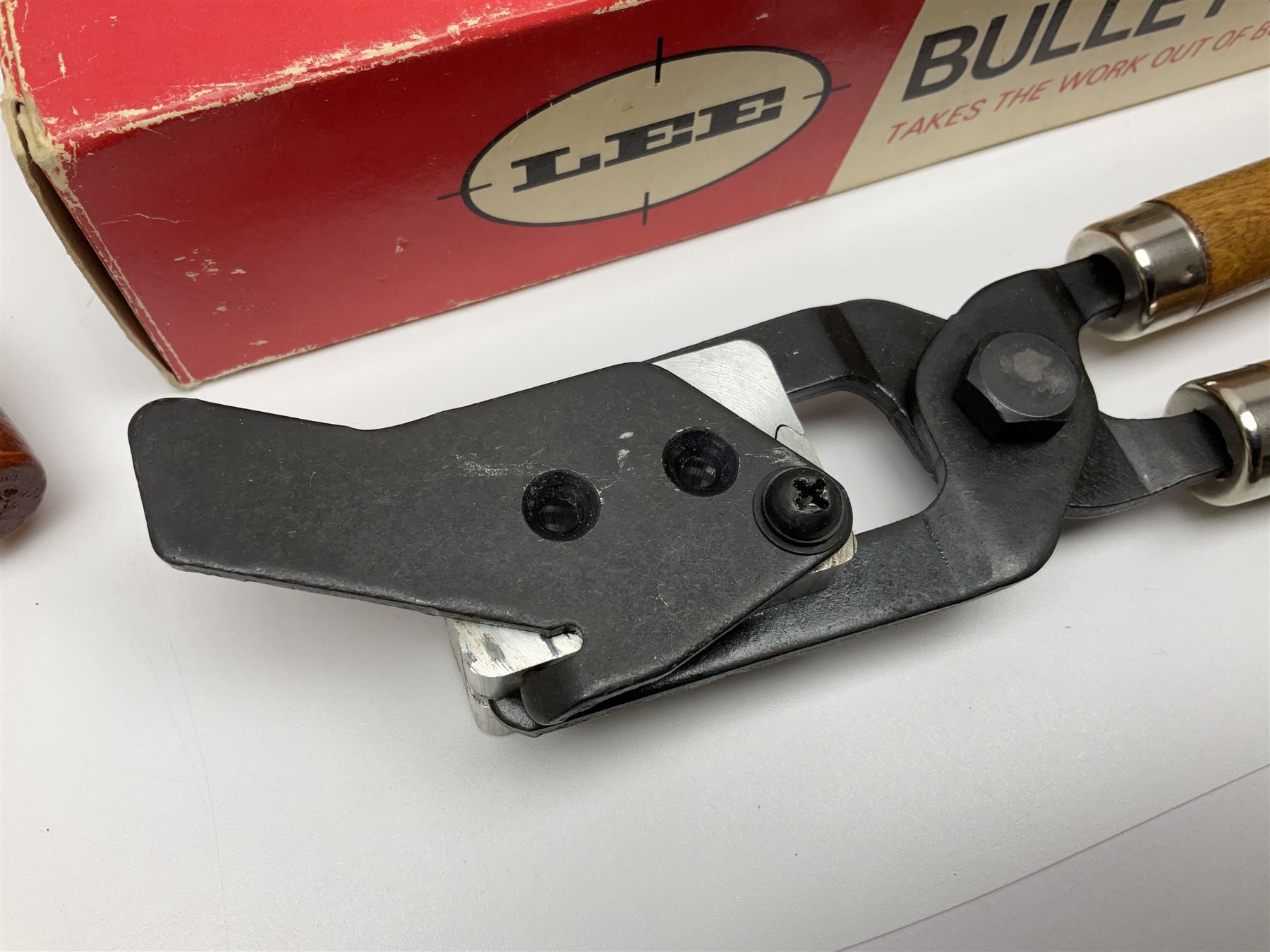 Three modern bullet moulds comprising Lee double cavity .44 calibre, boxed with instructions; and two Lyman .38 calibre; all in unrelated 19th century mahogany box