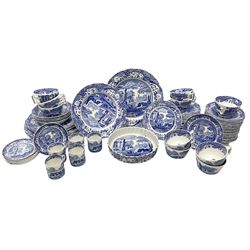 Spode blue and white Italian pattern dinner and tea wares, comprising five dinner plates, four side plates, seventeen side plates, four bowls, ten tea cups and twenty one saucers, five coffee cans and six saucers, and a flan dish, with blue and black printed marks beneath 