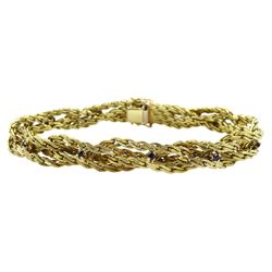 14ct gold four strand crossover bracelet, set with ten round sapphires, stamped 585