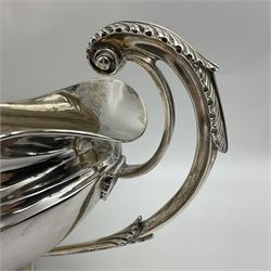 1920s silver twin-handled pedestal bowl, of navette form with twin bifurcated acanthus capped scroll handles, engraved with initial R to body and upon spreading oval foot, hallmarked Hawksworth, Eyre & Co Ltd, Sheffield 1925, including handles H21.8cm