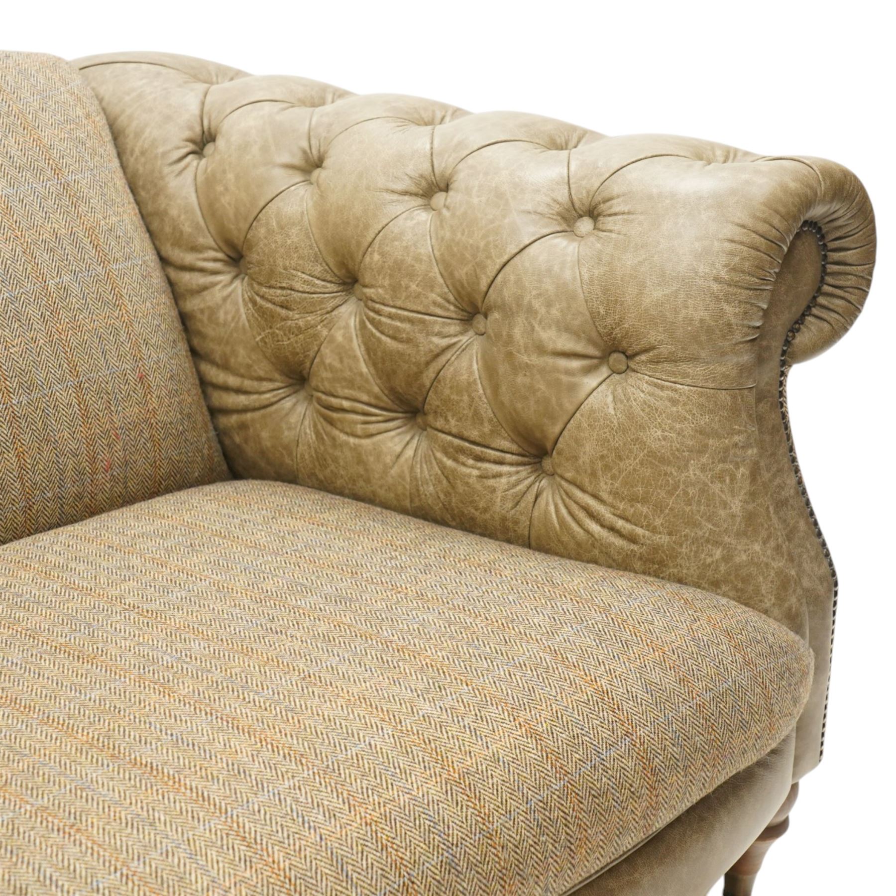 Tetrad - 'Matisse' snuggler armchair or loveseat, Chesterfield shape with rolled arms flanking a serpentine back and front, upholstered in herringbone pattern Harris Tweed and tan leather with close-nailed studwork, on turned feet