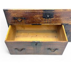 Late 19th century Japanese tansu chest, crafted with a cedar frame and cypress wood panels, original iron fittings throughout, comprising a single long drawer above smaller drawer and hinged cupboard door enclosing two smaller internal drawers and storage compartment, mounted on a bespoke black metal stand