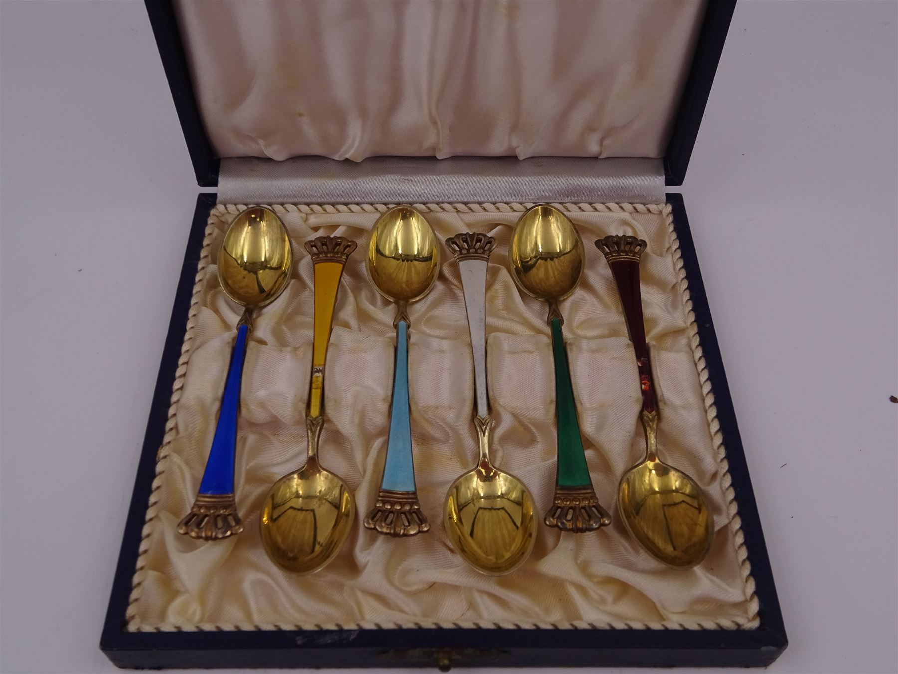 Set of six Danish silver-gilt harlequin enamel demitasse spoons with crown finials, by Egon Lauridsen, stamped ELA Denmark Sterling 925S, in fitted case