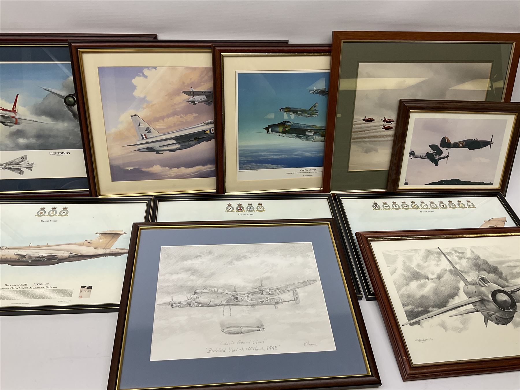 Thirteen framed and one unframed prints of military aircraft; and framed cross-stitch picture of a BAL Lightning F.6 (15)