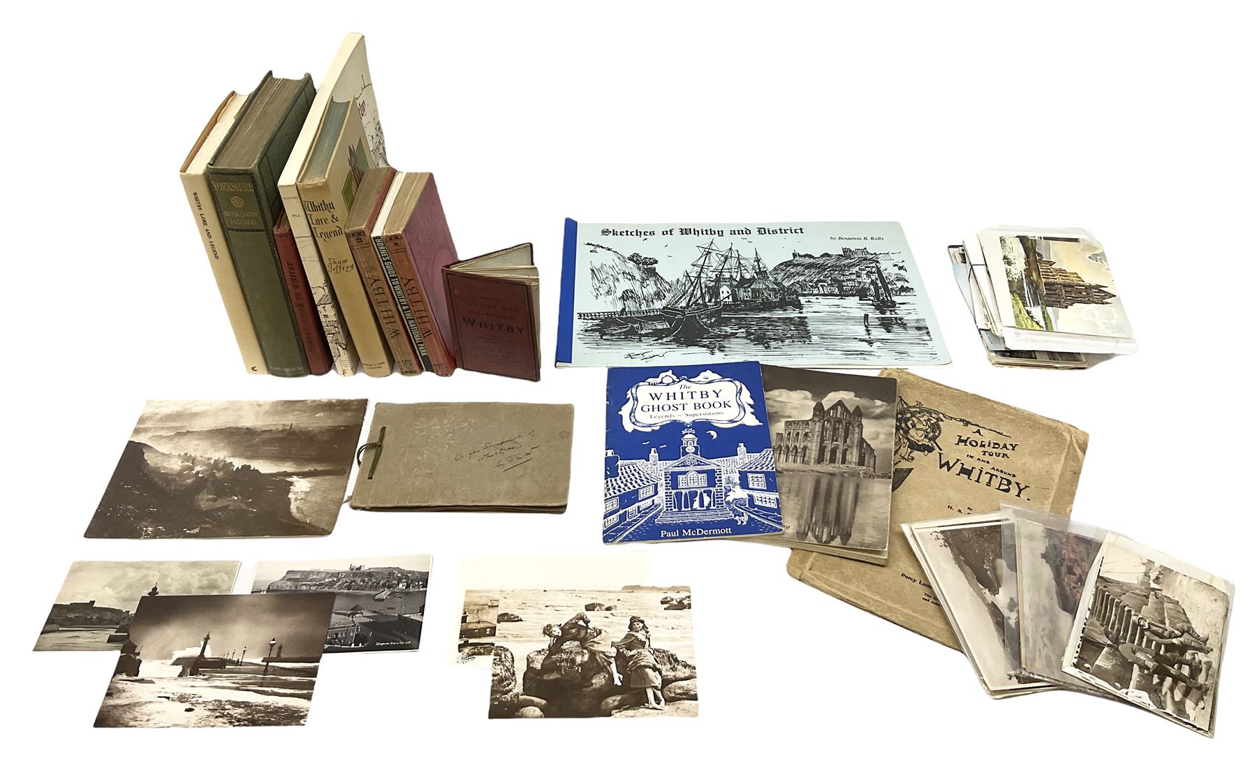 Quantity of books and postcards predominantly of Whitby interest including Hornes' Guide to Whitby 1890 and Hornes' Tourist map of Whitby, A Holiday Tour in and Around Whitby by H.S. Forman 1896 etc