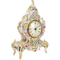 Reine Handarbeit, German ceramic cased mantle clock with applied floral decoration, together with two vases, clock H31cm