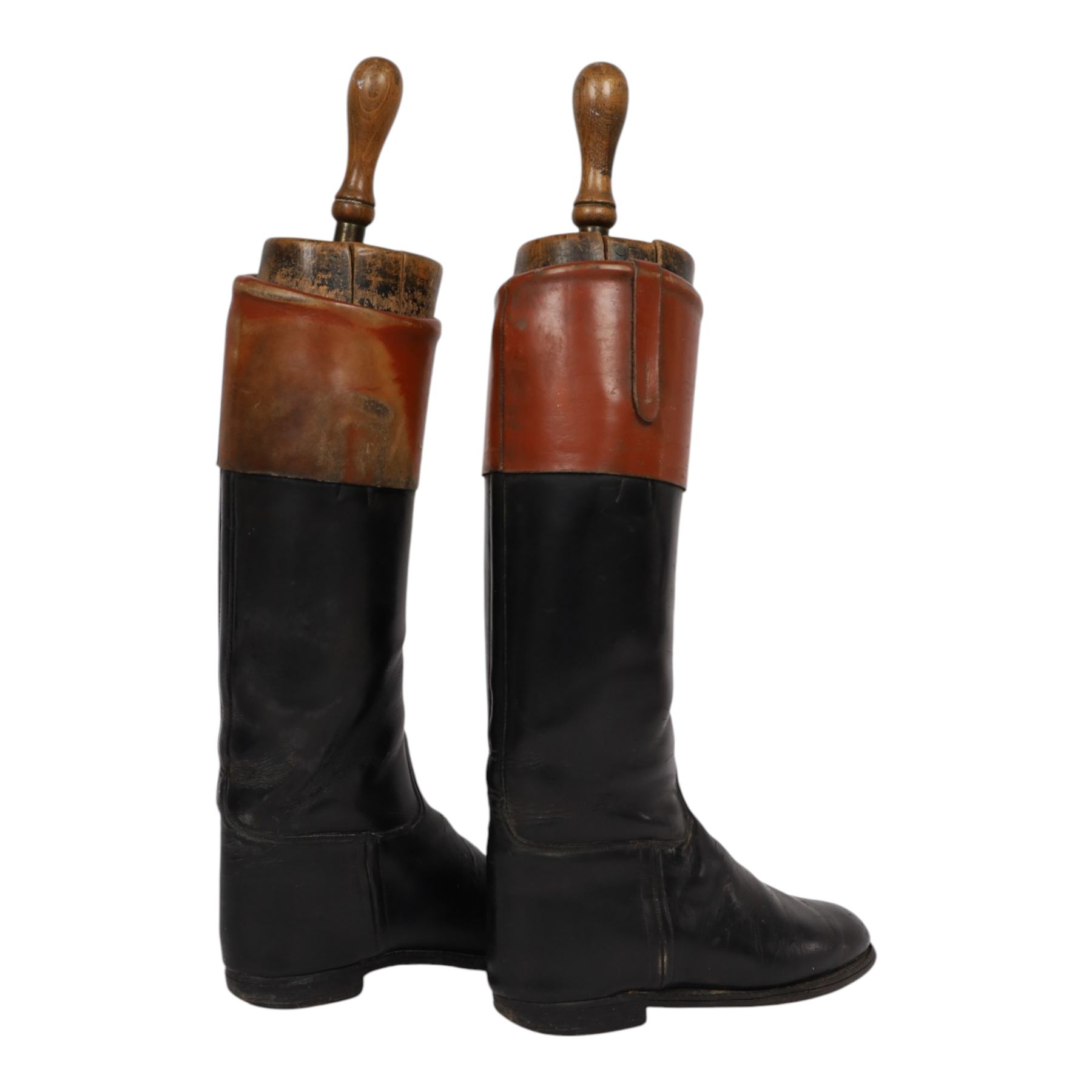 Pair of brown leather topped riding boots, with wooden shoe trees