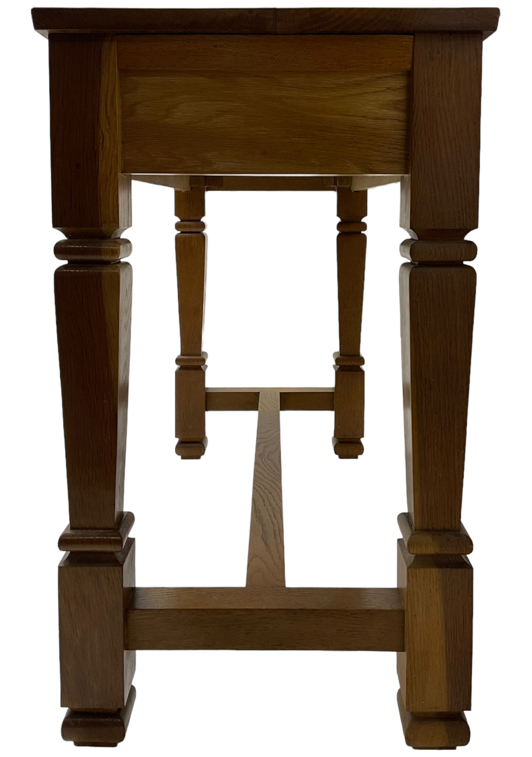 Solid oak console table, rectangular top raised on turned square supports united by stretcher