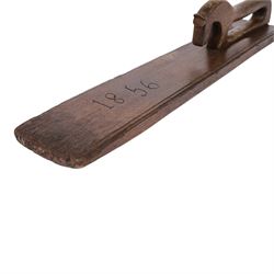 Mid 19th century Norwegian carved mangle board, dated 1856, of rectangular form with stepped edges, and carved dala horse handle, L63cm