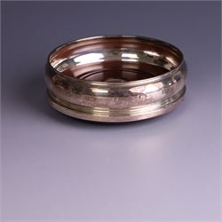 Modern silver mounted bottle coaster, with turned wooden base, hallmarked Carrs of Sheffield Ltd, Sheffield 2003 and a Victorian silver inkwell stand, hallmarks worn and indistinct, coaster D10cm