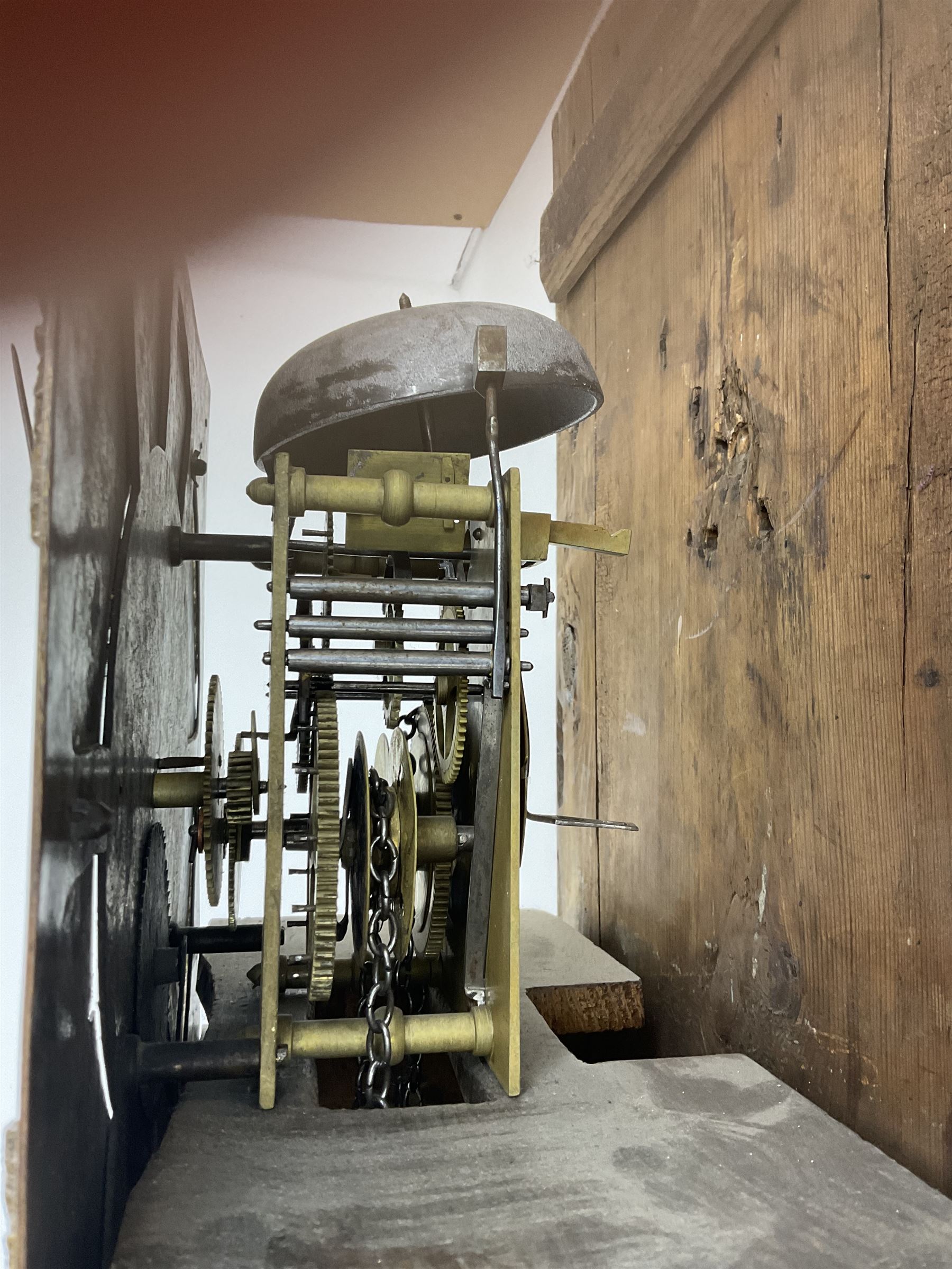 John Fletcher of Barnsley - Mid18th century 30-hour oak cased longcase clock, with a flat pediment and broad cornice, square hood door with attached pillars and gesso capitals, long trunk and conforming door with a break arch top, square plinth on a shaped base, brass dial with cast spandrels and engraved dial centre, chapter ring with Roman numerals and five minute Arabic’s, engraved calendar dial and steel hands, chain driven count wheel movement striking the hours on a bell. With pendulum and weight. The Fletcher family were a prolific family of clockmakers working in Barnsley (Yorks) during the 18th and early 19th century.