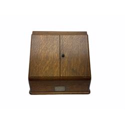 Oak correspondence box, the sloped front opening to reveal a fitted interior with letter rack and calendar, H34cm W39cm. 