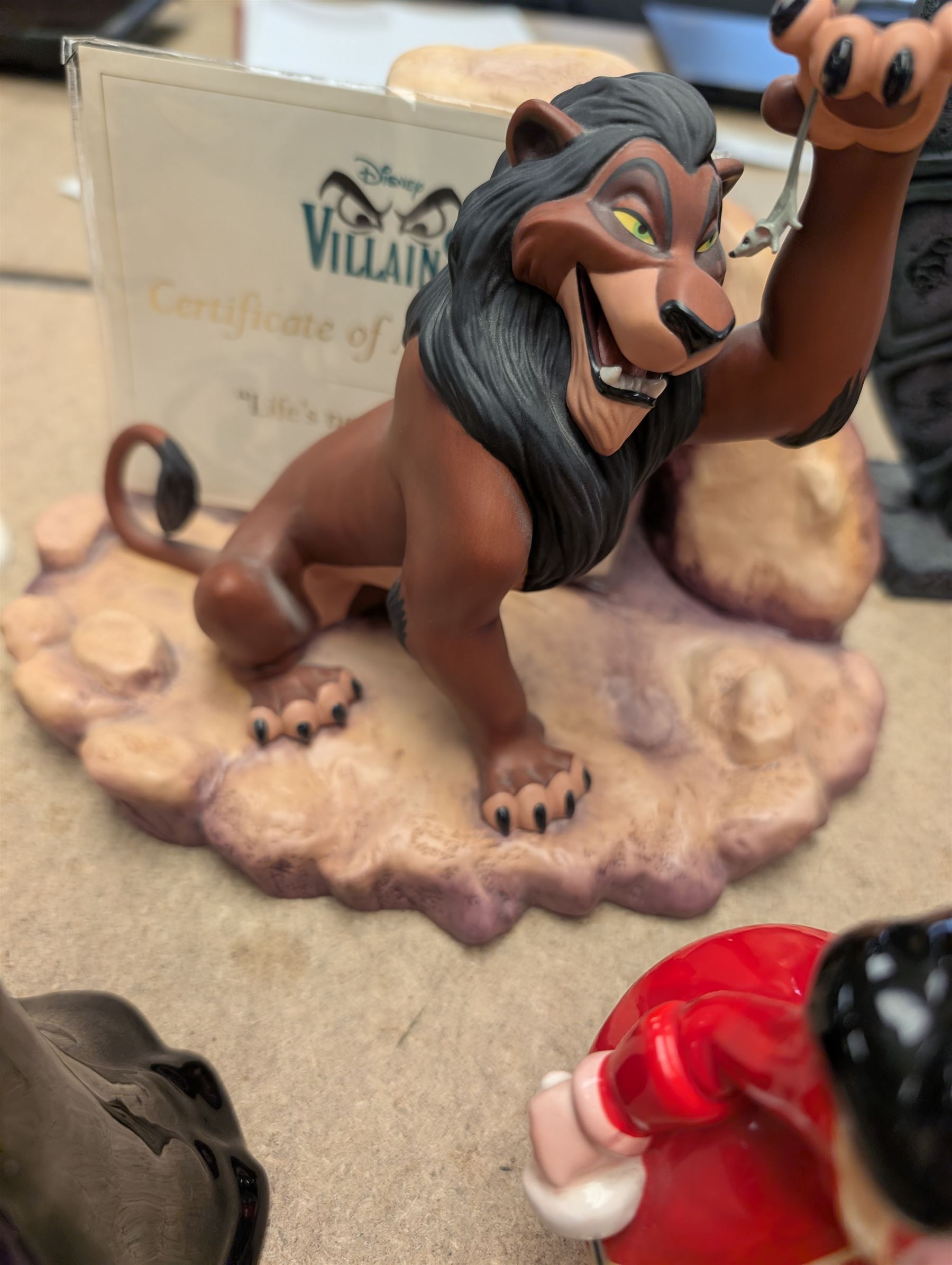Collection of Disney figurines, comprising Disney Villains 'Life's Not Fair, is it?', with certificate of authenticity, Snow White Magic Mirror and seven ceramic figures including Jafar, Queen of Hearts and Scar