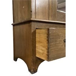 Edwardian oak single wardrobe, projecting cornice over dentil frieze, bevel mirror panelled door enclosing hanging rail and hooks, flanked by oval Art Nouveau decorated panels, single drawer to base