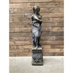 Cast stone weathered garden statue of Venus on pedestal