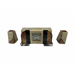 1950’s English Art Deco mantle clock with conforming side ornaments, rectangular case with several contrasting marble panels raised on a shaped marble plinth, four-inch silver effect square dial with Arabic numerals, minute track and steel hands, chrome plated bezel with a flat glass, spring driven balance wheel movement.