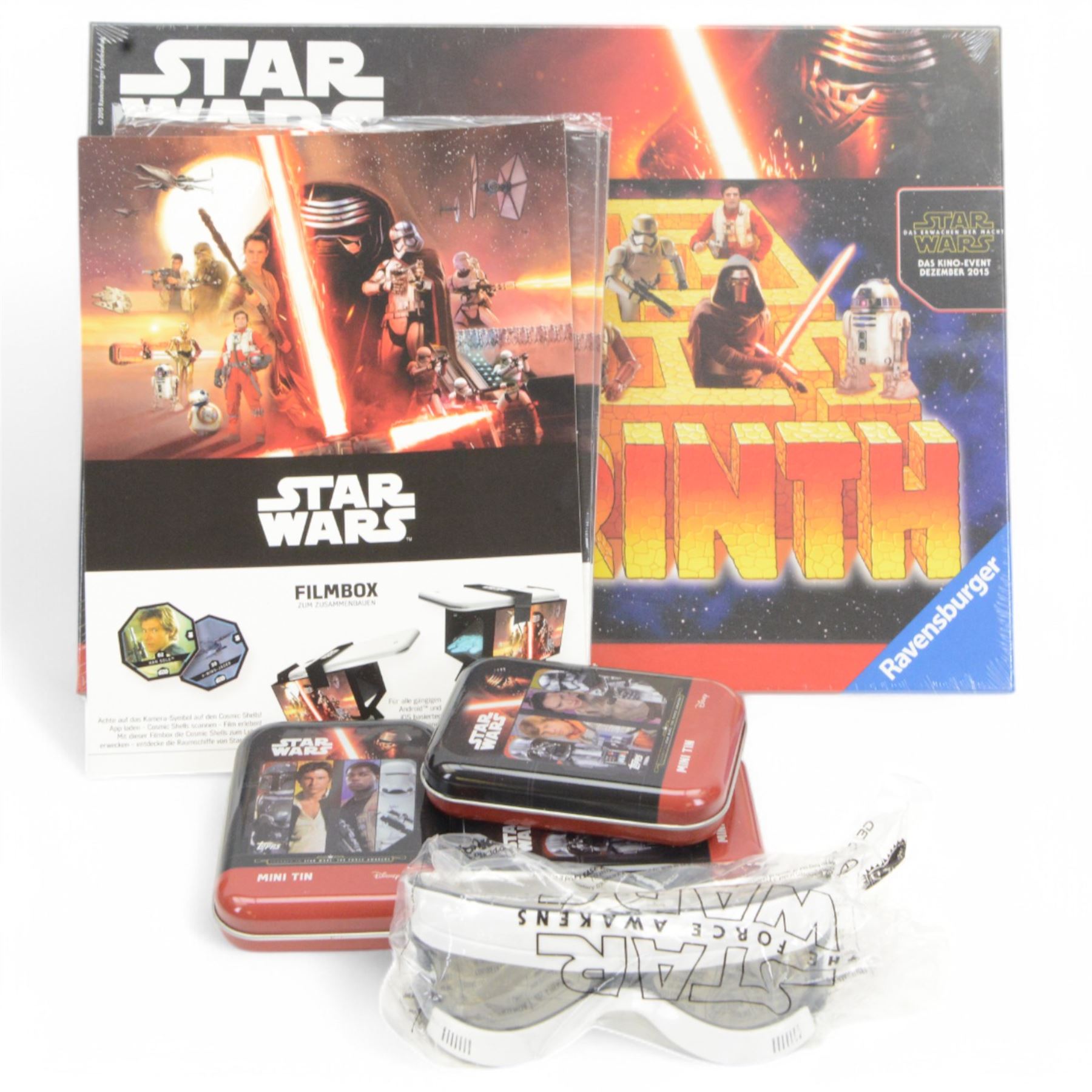 Star Wars puzzles and games, including four sealed MB Games 200piece jigsaw puzzles, two Darth Vader sculpture puzzles, limited edition sealed Ravensburger The Force Awakens Labyrinth game, two Special Edition Star Wars Trilogy Mousemats in original packaging, and a collection of Star Wars The Force Awakens ephemera including tins, flags, 3D glasses, etc