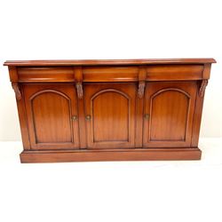 Waring & Gillow cherry wood sideboard, three drawers above three cupboards, platform base