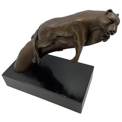 Bronze modelled as a cougar on a branch upon a rectangular wooden plinth, H24cm