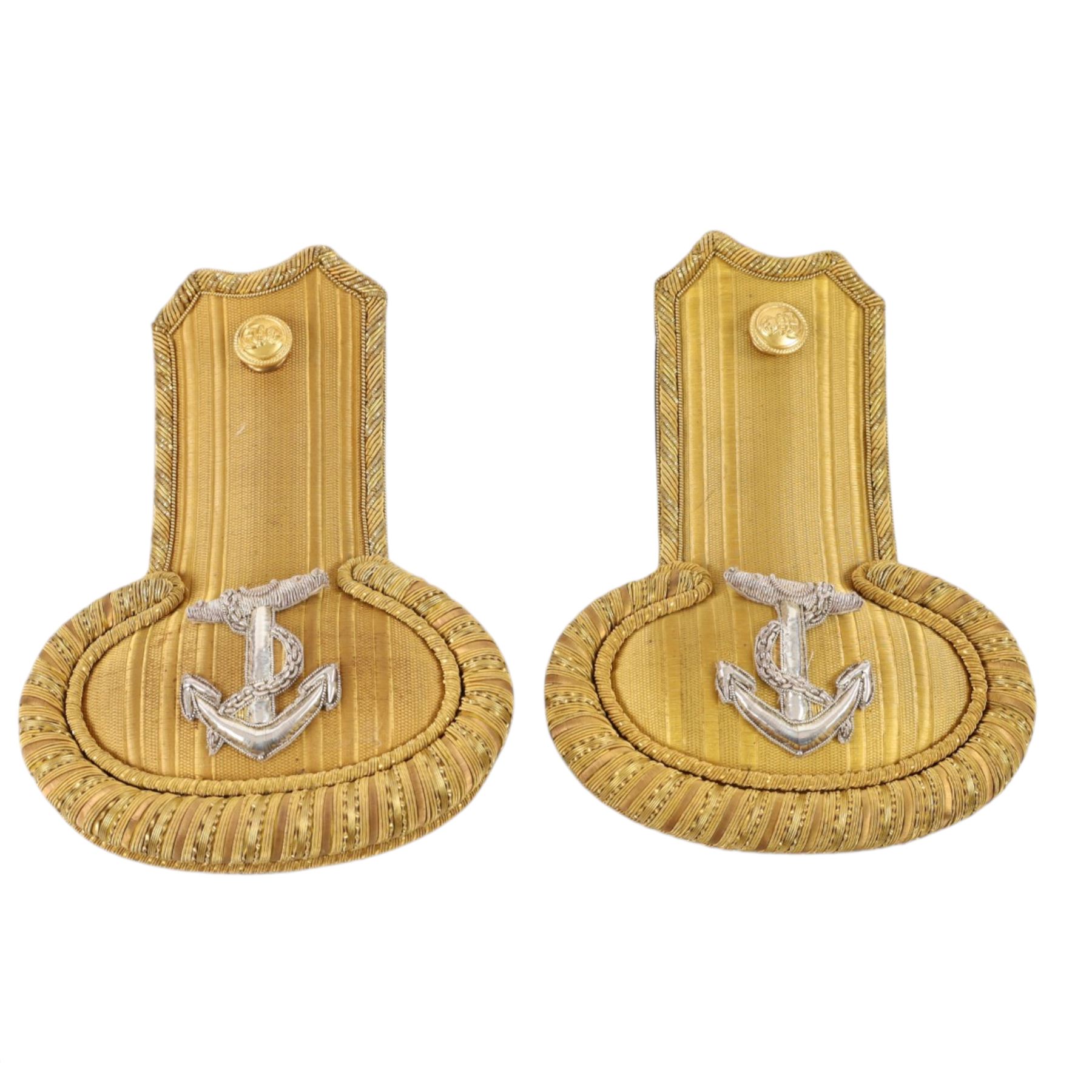 Early 20th century Royal Navy officers full dress bicorn hat, belt and epaulettes, the bicorn in black with gilt wire side and RN button, bullion work to each end marked to the interior with Gieves makers mark, all housed in fitted case