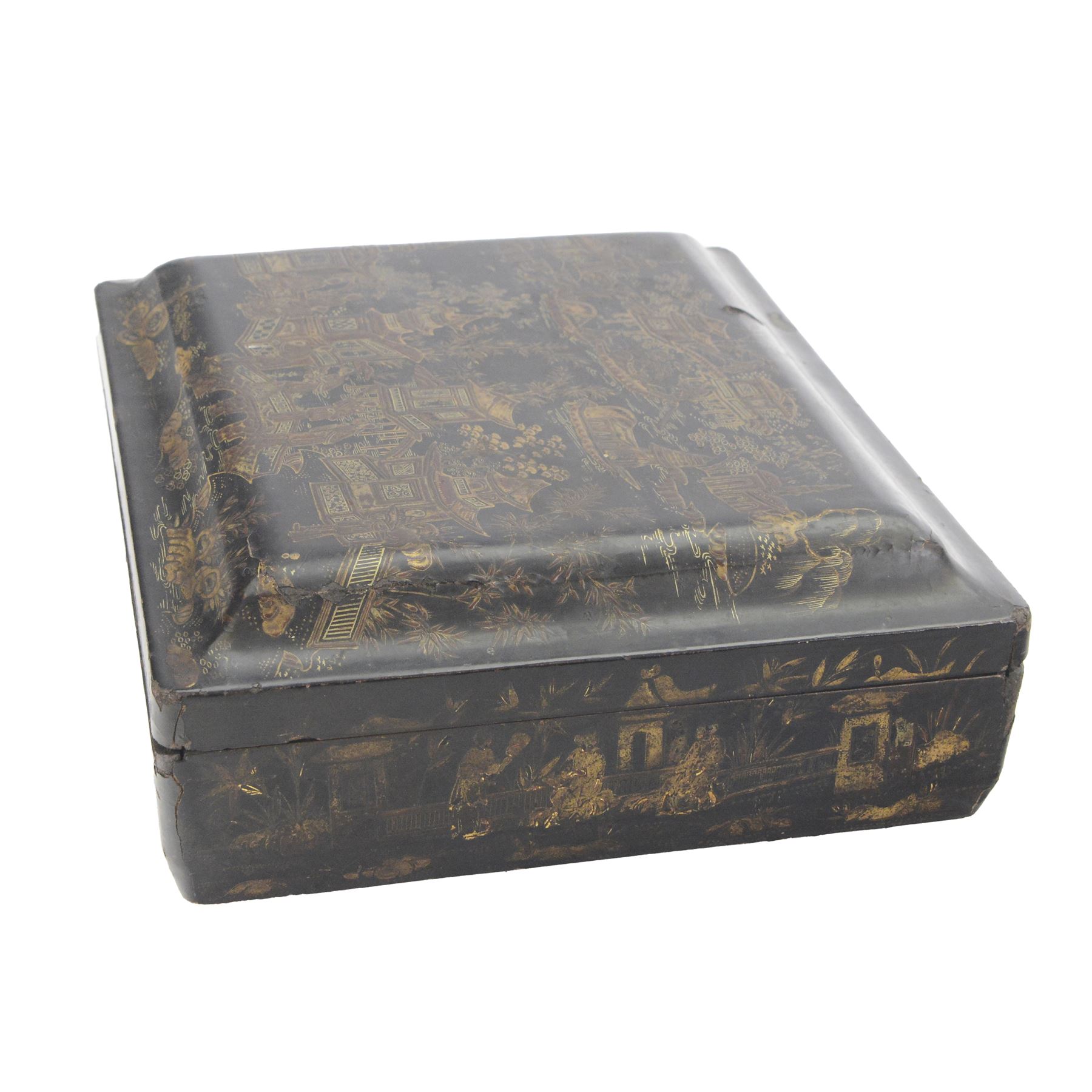 19th century Chinese export black lacquered games box, of rectangular form decorated to the exterior with figures, pagodas and bridges in a riverside landscape in red and gilt, the lift off cover opening to reveal a compartmented interior with four removable covered boxes decorated with conforming figural scenes, and eight trays decorated with stylised suits, H10cm W30cm D27cm