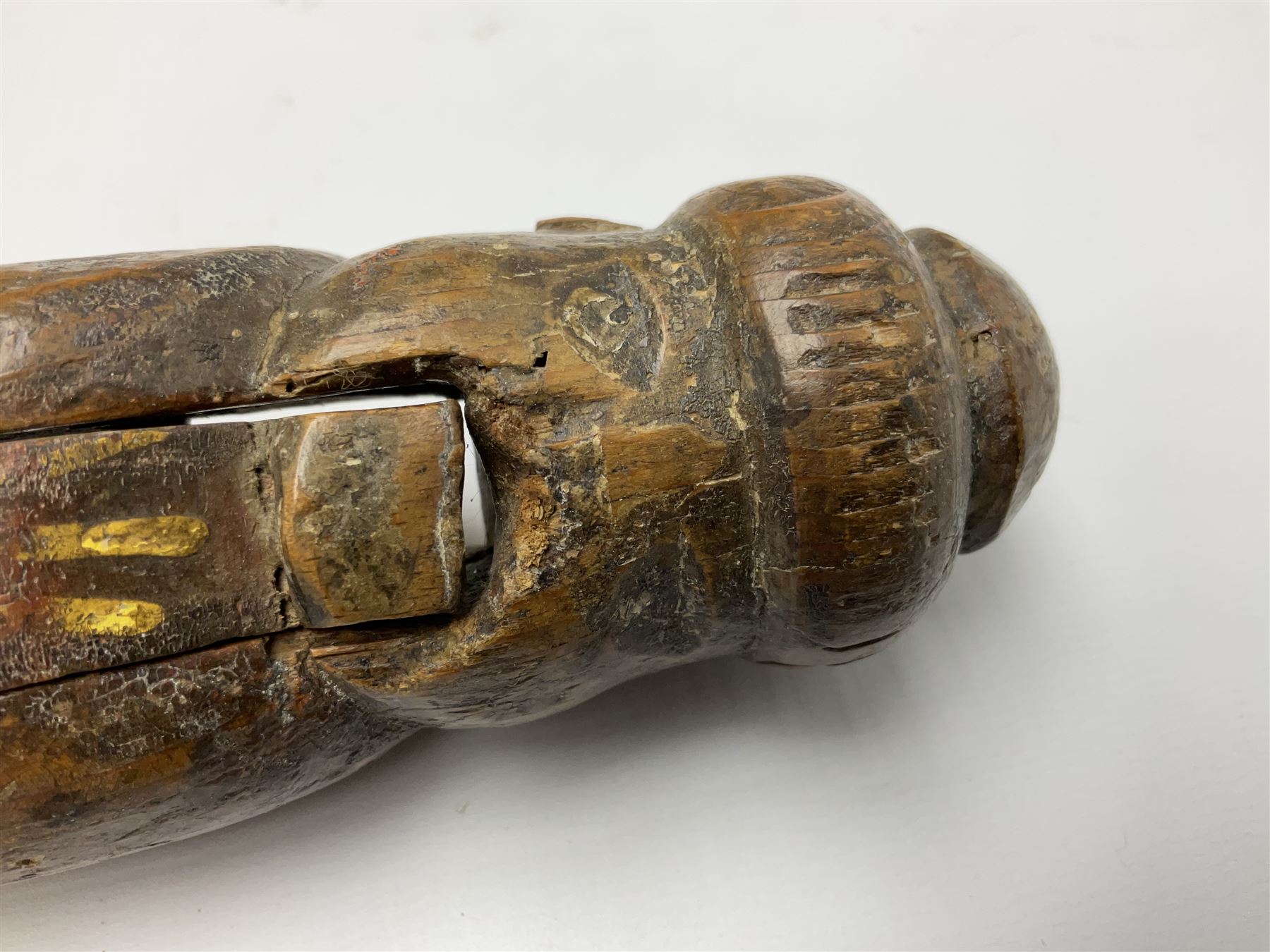 Rare primitive treen lever action nutcracker, probably late 17th/early 18th century, carved in the form of a man, with old collector label to side inscribed 'A Nutcracker XVI Century', H18cm