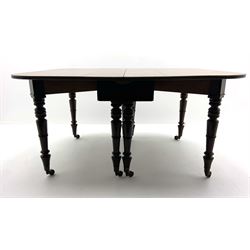 George III mahogany extending dining table, pull out concertina action, raised on eight collar turned supports with brass cups and castors