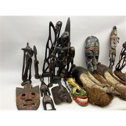 African carved wood figures, various masks including painted examples and other similar items 