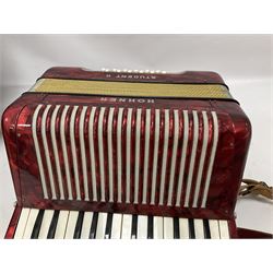 German Hohner student II compact accordion with 26 keys and 12 bass registers in a hard case With tutor