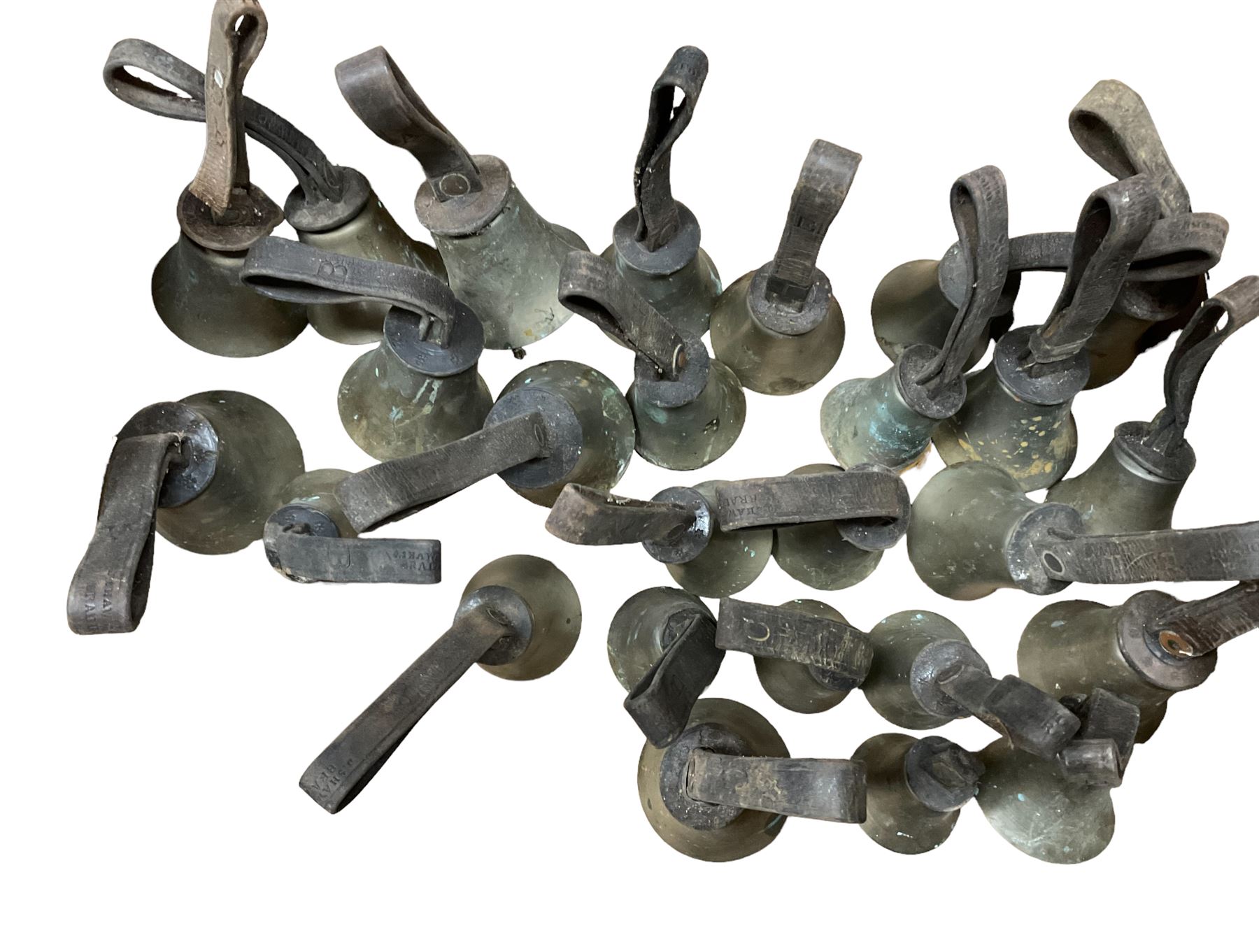 Collection of 44 late 19th century brass church/musical handbells with leather straps by James Shaw Brothers of Bradford and bells marked G.W. possibly cast by the George Welch bell foundry, London.
The number of bells and stated notation, some at different pitch, is as follows;
5 “C”, 4 “D”, 5 “E”, 4 “F”, 5 “G”, 5 “A”, 6 “B”.
3 “F#”, 4 “C#”,1 “Db”, 1 “G#”, 1”A#”.
Two of the bells are minus their clappers and one bell has no leather strap.
