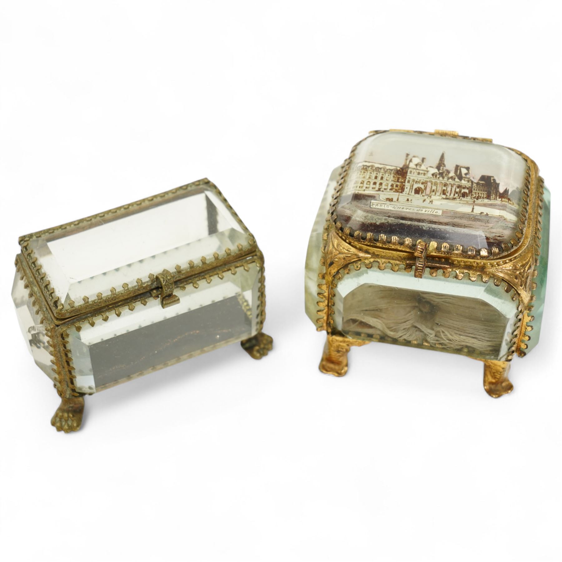 French bevelled glass bijouterie boxes, with gilt metal framing, raised on scrolled and paw feet, the square example with 'Le Hotel de Ville - Paris' scene to cover (2)