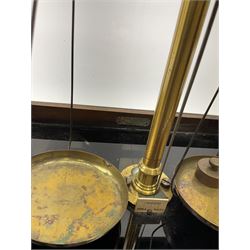 Set of laboratory balance scales by Paul Bunge Hamburg Model 9A No.7977 bearing label for Reynolds & Branson Leeds in mahogany case with upward sliding front door, two hinged side doors, hand cranked rise-and-fall facility and black vitrolite base L36cm H42cm D26cm; and two boxed part sets of weights (3)