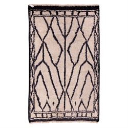 Moroccan Berber wool hand knotted rug, the cream ground decorated with abstract diamond fo...