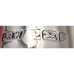 Modern silver two piece cruet set, comprising salt shaker and pepper shaker, both of waisted form with engraved rope twist borders, the removable pierced covers each with engraved lattice decoration, upon a circular spreading foot, hallmarked Laurence R Watson & Co, Birmingham 1989, H14.5cm, contained within velvet lined fitted case