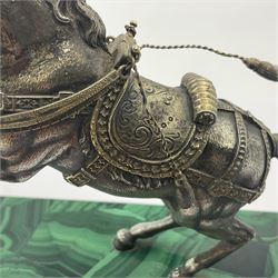 Modern silver model of a rearing horse, with ornate parcel gilt saddle and bridle, mounted upon a rectangular base, decorated with malachite panels to each side and upon four gilt bun feet, horse stamped 925, overall H14.5cm