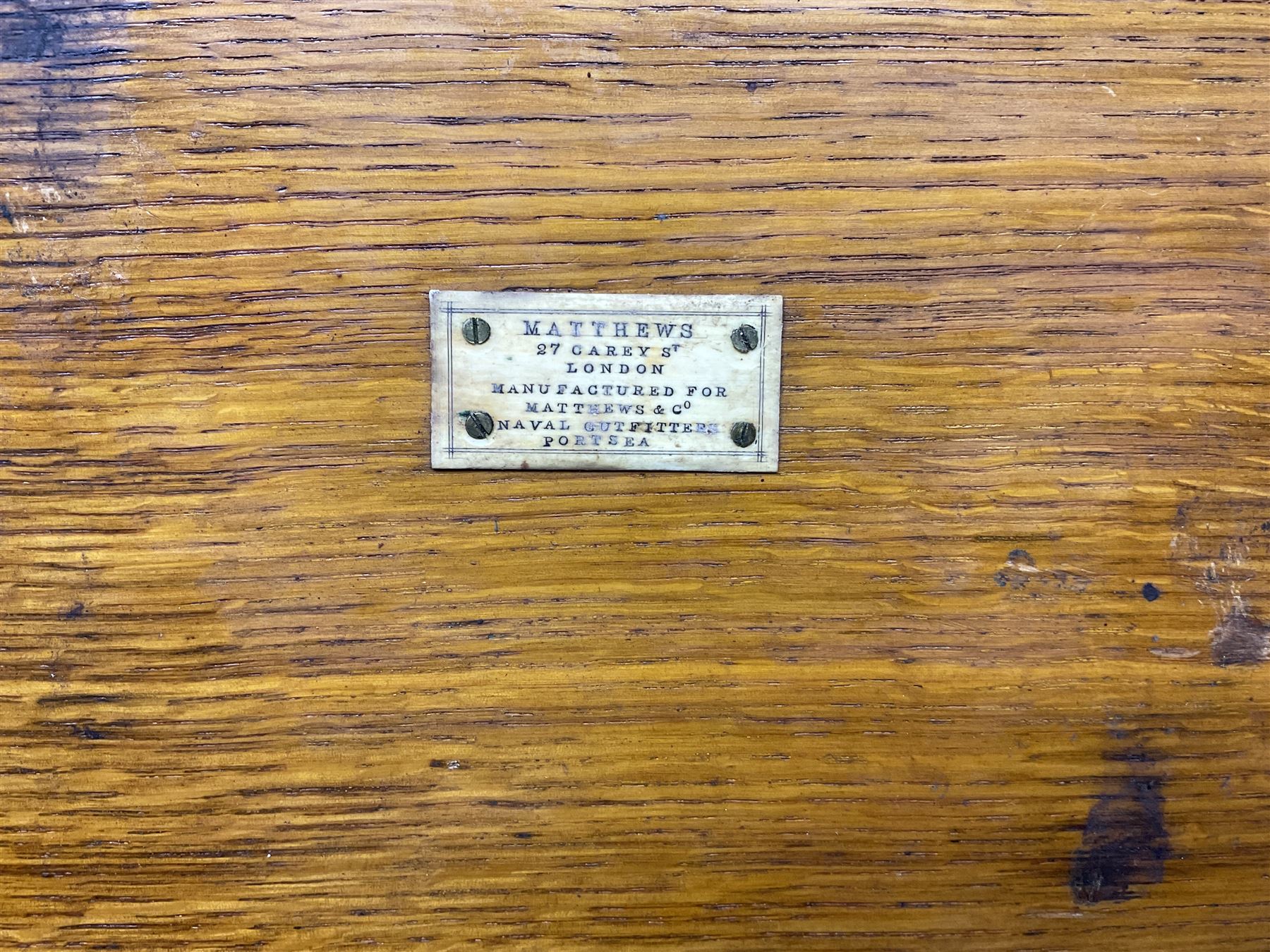 Naval doctor's surgical instruments, contained in a converted brass bound oak pistol box, the hinged lid opening to reveal two removable fitted trays, containing 19th century and later saws, scalpels, tweezers etc