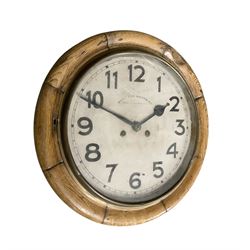 Early 20th century German spring driven striking wall clock with a 12” painted dial and spun bezel.