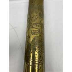WW1 German brass shell case inscribed PATRONENFABRIK KARLSRUHE 1917 decorated with a large Chinese style dragon H50cm; and another brass 105mm shell case dated 1968 applied with twenty-eight Staybrite and other cap badges including Rhodesia, Royal Marines, Canadian Light Infantry, 17th lancers, RAOC, REME, Military Police etc H37cm (2)