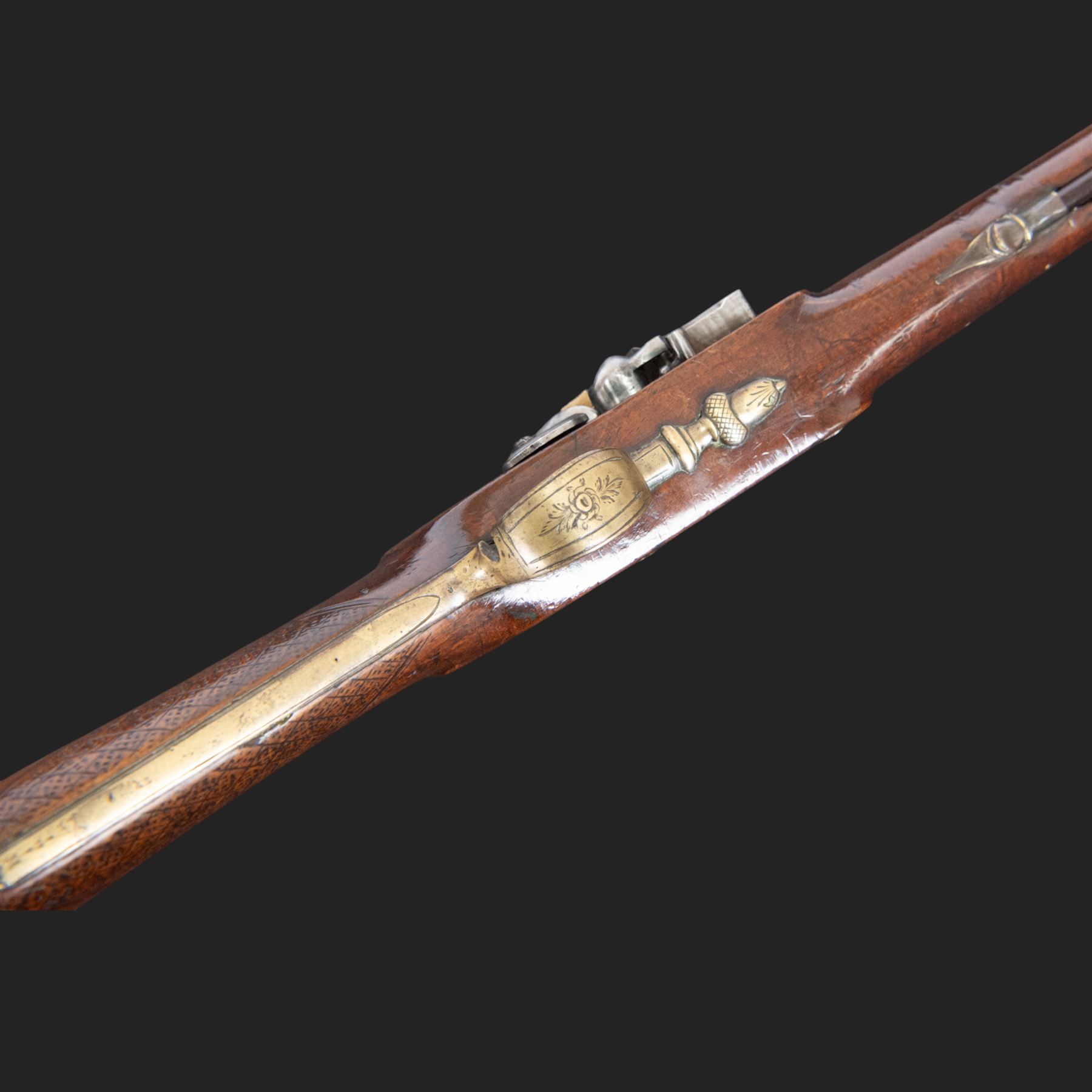 English flintlock blunderbuss, circa 1780 by R. Sutherland of London, the 32cm brass barrel with proof marks and London to the top, with original ramrod with brass tip below, the lock engraved Sutherland, walnut stock with brass butt plate, steel trigger guard with acorn finial, overall L70cm  