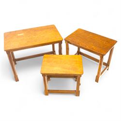 Mouseman - oak nest of tables, adzed rectangular top, on shaped octagonal supports joined ...