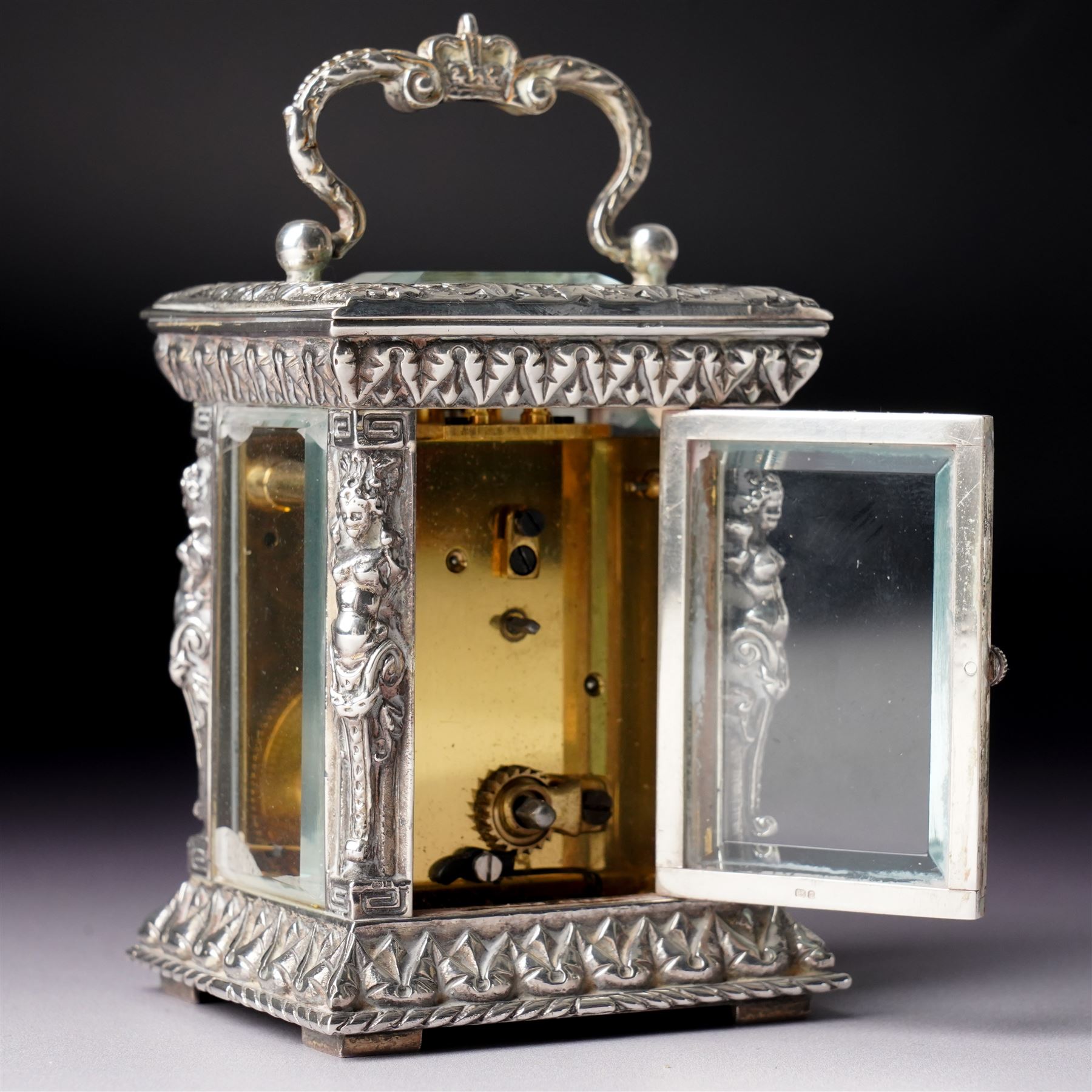 Chas Frodsham -  Miniature carriage clock with white dial and platform lever escapement in cast silver case with caryatid columns and bevelled glass panels H10cm  London assay No.0468