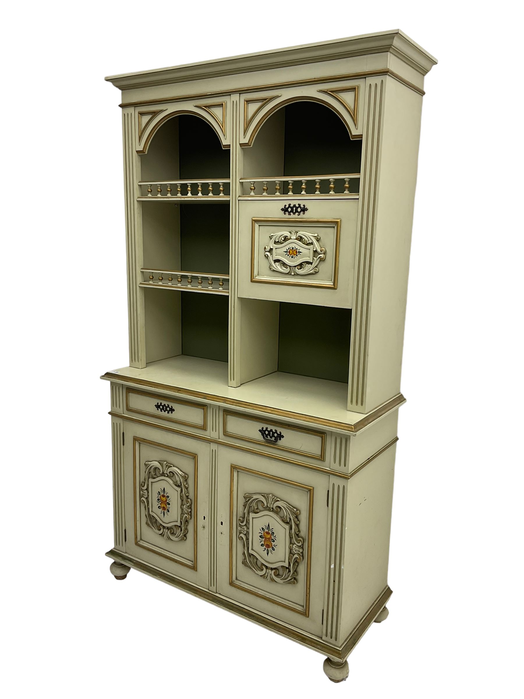 Portuguese painted dresser, two-tier plate rack with spindle gallery and fall-front cupboard, flanked by fluted uprights, fitted with two drawers over two cupboards, the panelled cupboards with floral decoration and a rinceaux border, white painted and parcel-gilt 